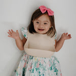 Load image into Gallery viewer, Mushie Silicone Baby Bib - Happyness
