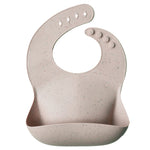 Load image into Gallery viewer, Mushie Silicone Baby Bib - Happyness
